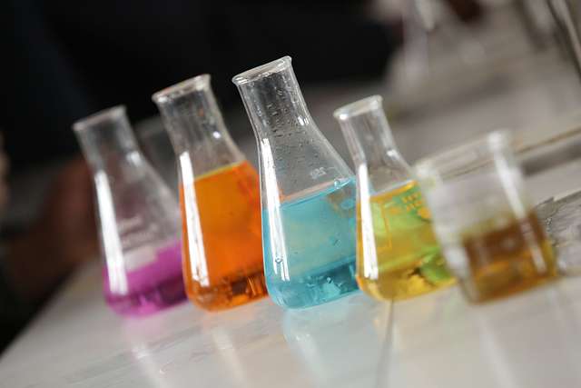 Erlenmeyer flasks with colored liquids
